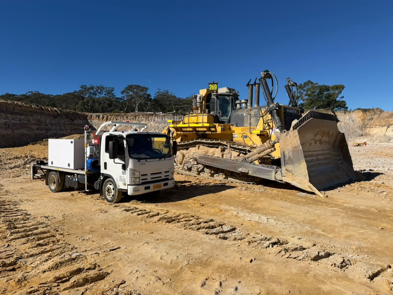 Mobile service truck on heavy equipment job site
